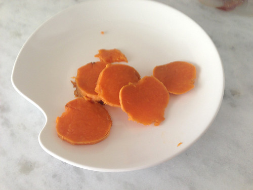 Slices of sweet potatoes cut for a child to eat