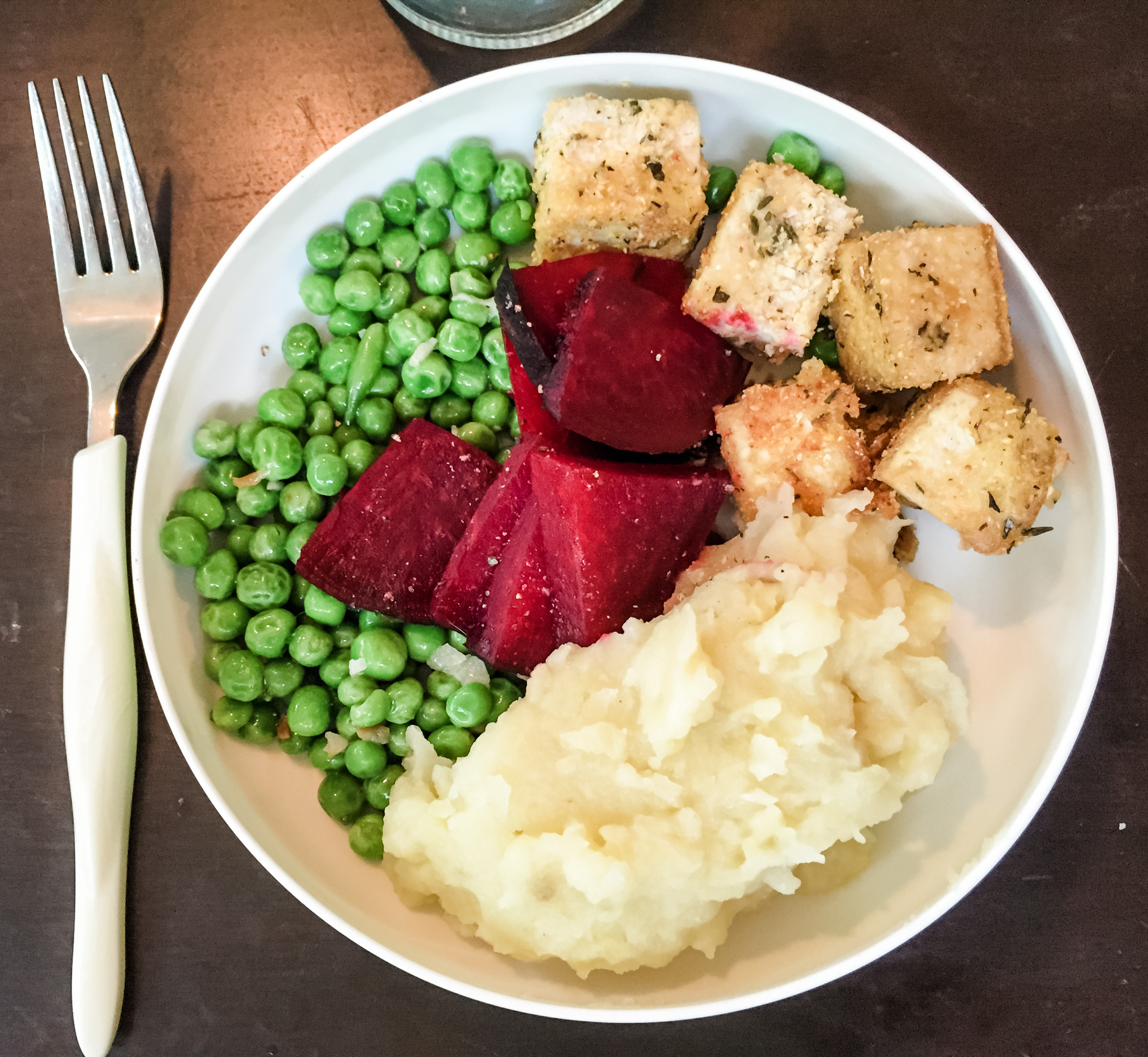 Vegan meal for baby: Crispy tofu, fresh peas, mashed potatoes, and beets